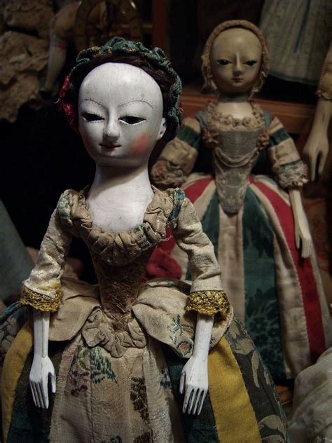 The Symbolism of Fable Magical Wooden Dolls with Tin in Traditional Culture